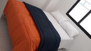 Postel nebo postele na pokoji v ubytování Hotel Zetta Village