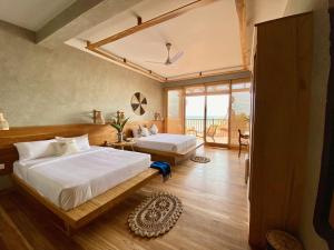 Postel nebo postele na pokoji v ubytování Coast 67 Boutique Hotel