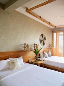 Postel nebo postele na pokoji v ubytování Coast 67 Boutique Hotel