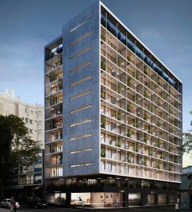 a tall building with a lot of windows at Brand New! Urban Bliss Stay - Luxe Living in Montevideo