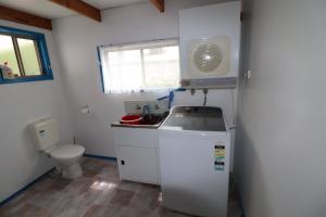 a small bathroom with a sink and a toilet at 5 Greer Street in Mallacoota +11 photos