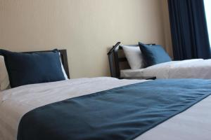 Postel nebo postele na pokoji v ubytování Ayan Hotel