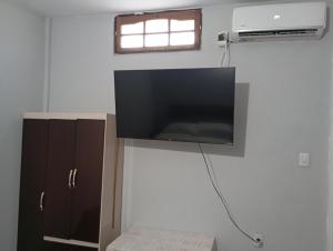 a flat screen tv on a wall in a room at Los Cactus 2 in La Rioja