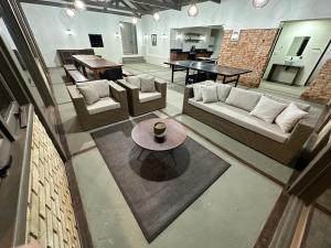 a large living room with couches and a table at Barra Velha - Itajuba Beach House in Itajubá