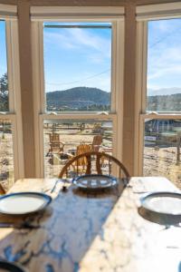a dining room table with a view of the ocean at Mountain Farm Stay, Alpacas and Views, Royal Gorge 15min in Canon City +55 photos
