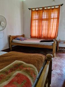 Postel nebo postele na pokoji v ubytování Athena Homestay