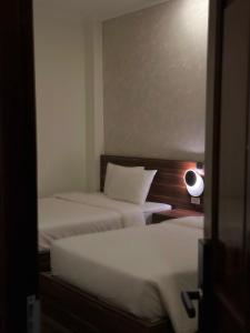 Letto o letti in una camera di Hong Nhan Hotel