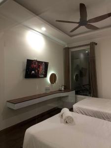 Letto o letti in una camera di Hong Nhan Hotel