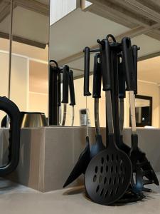 a kitchen counter with utensils on a counter top at Moderno y cómodo departamento in Coquimbo