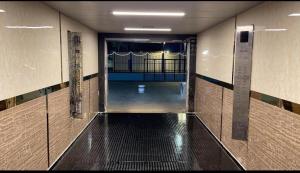 an empty hallway with a walkway in a building at شقة مطلة على البحر والفورمولا ببرج المسارات in Jeddah