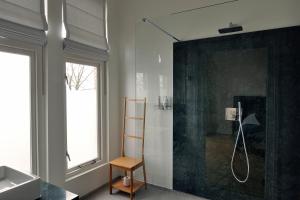 Ett badrum på Boetiek Hotel Kampen