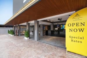 an open now special rates sign in front of a building at Aspira Escape Ao Nang Krabi in Ao Nang Beach
