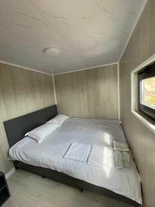 Ένα ή περισσότερα κρεβάτια σε δωμάτιο στο Орлиное гнездо