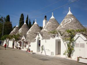 a group of buildings with pointed roofs on a street at Due Passi Dal Borgo Antico in Bari
