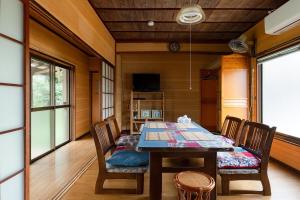 a dining room with a table and chairs at 音毬 - Otomari - in Miyazu