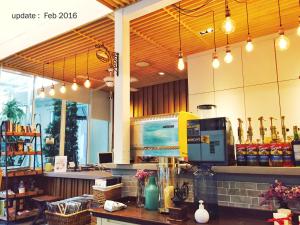 a coffee shop with a counter with a coffee maker at Costa Village Pool Villa in Jomtien Beach