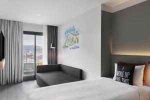 Posteľ alebo postele v izbe v ubytovaní Moxy Barcelona