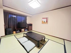 Posezení v ubytování Route Inn Grantia Hidatakayama Wakura no yado