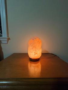 a rock sitting on top of a wooden table at The Regal Haven in Metuchen