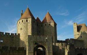 an old castle with a tower and a gate at Chez Pauline & Vincent Côté Canal in Carcassonne