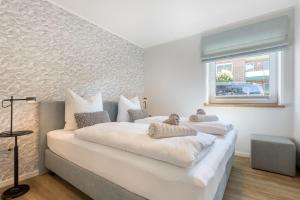 Giường trong phòng chung tại Deichlodge-1