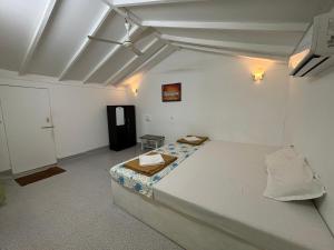 Ένα ή περισσότερα κρεβάτια σε δωμάτιο στο San Pedro Resort Palolem