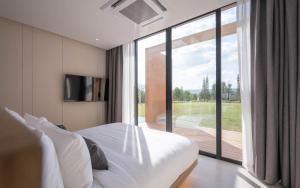 Postel nebo postele na pokoji v ubytování De Capoc Resort