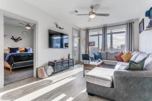 a living room with a couch and a bed at San Antonio TX Condo on Riverwalk w King Ste,Pets in San Antonio