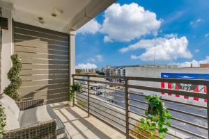 a balcony with chairs and a view of the water at San Antonio TX Condo on Riverwalk w King Ste,Pets in San Antonio