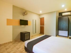 Ένα ή περισσότερα κρεβάτια σε δωμάτιο στο Hotel O MAP INN