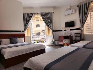 Postel nebo postele na pokoji v ubytování HOME Hotel