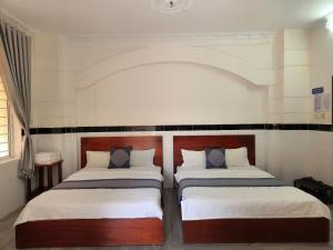 Postel nebo postele na pokoji v ubytování HOME Hotel