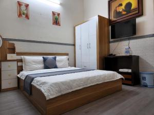 Postel nebo postele na pokoji v ubytování HOME Hotel