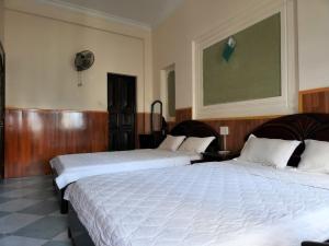 Postel nebo postele na pokoji v ubytování HOME Hotel