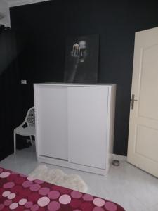a white podium in a room with a chair and a rug at Hurghada HOME in Hurghada