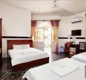 Postel nebo postele na pokoji v ubytování HOME Hotel