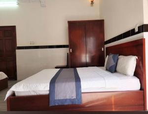 Postel nebo postele na pokoji v ubytování HOME Hotel