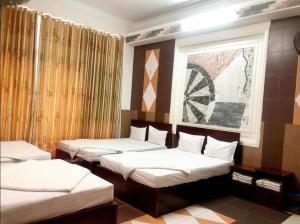 Postel nebo postele na pokoji v ubytování HOME Hotel