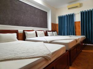 Postel nebo postele na pokoji v ubytování HOME Hotel