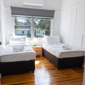 Postel nebo postele na pokoji v ubytování Maydena Lodge