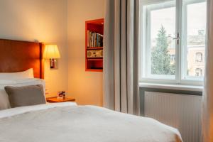 Katil atau katil-katil dalam bilik di Boutique & Design Hotel AUERSPERG