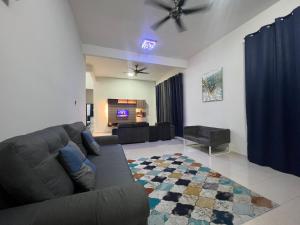 Posezení v ubytování Relax Homestay Kuantan + 2 fotografie