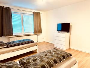 Μια τηλεόραση ή/και κέντρο ψυχαγωγίας στο Wohnung Friesland EG