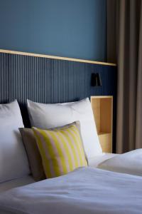 Postel nebo postele na pokoji v ubytování Hotel UND - smart alpine stay