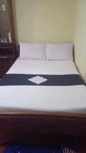 Кровать или кровати в номере Haranya Homestay