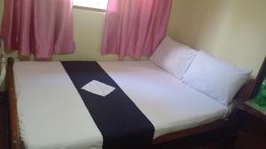Кровать или кровати в номере Haranya Homestay