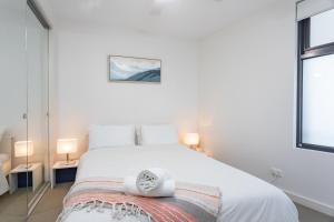 Ένα ή περισσότερα κρεβάτια σε δωμάτιο στο C-Scape Penthouse - Cowes beach front
