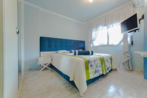 Кровать или кровати в номере Toroni Luxury Villas