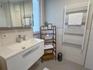 Koupelna v ubytování "THREE" - Premium Apartments Seekirchen, modern, zentral gelegen