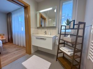 Koupelna v ubytování "THREE" - Premium Apartments Seekirchen, modern, zentral gelegen